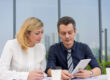Business owners discussing partner buyout financing options