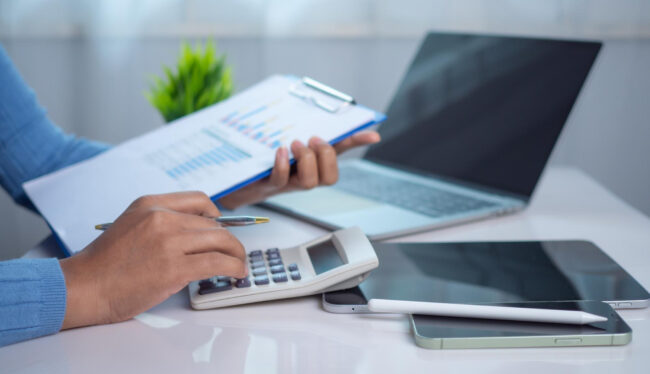 small business owner analyzing finances while using working capital loans to manage seasonal cash flow