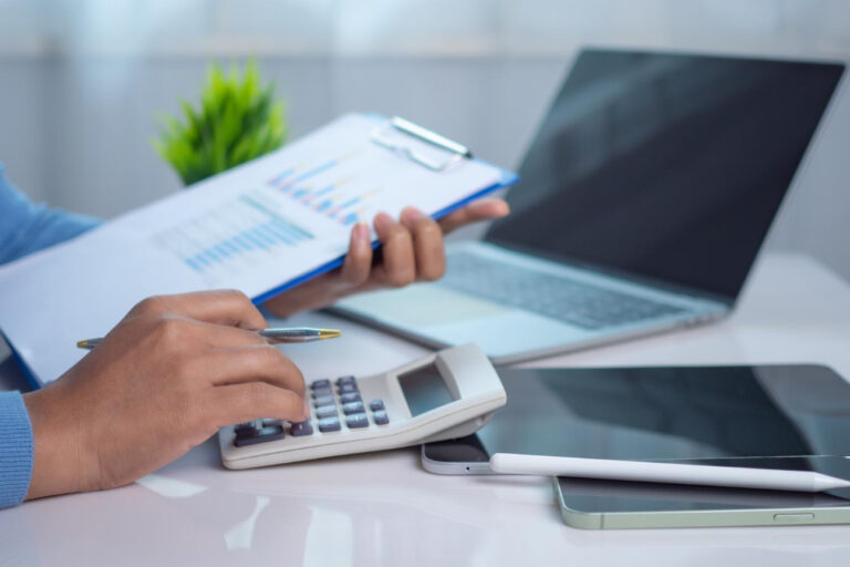 3331 small business owner analyzing finances while using working capital loans to manage seasonal cash flow