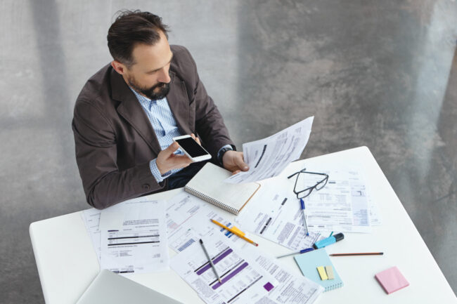 Business owner planning infrastructure financing for facility and equipment upgrades