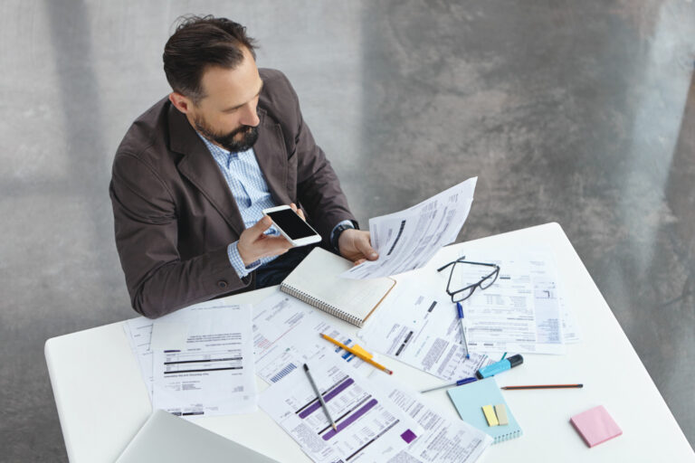 Infrastructure Financing for Business Upgrades Business owner planning infrastructure financing for facility and equipment upgrades