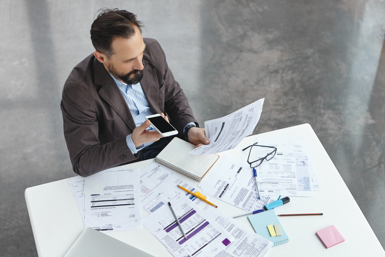 Infrastructure Financing for Business Upgrades Business owner planning infrastructure financing for facility and equipment upgrades