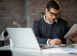 business owner planning business loan strategy with financial documents
