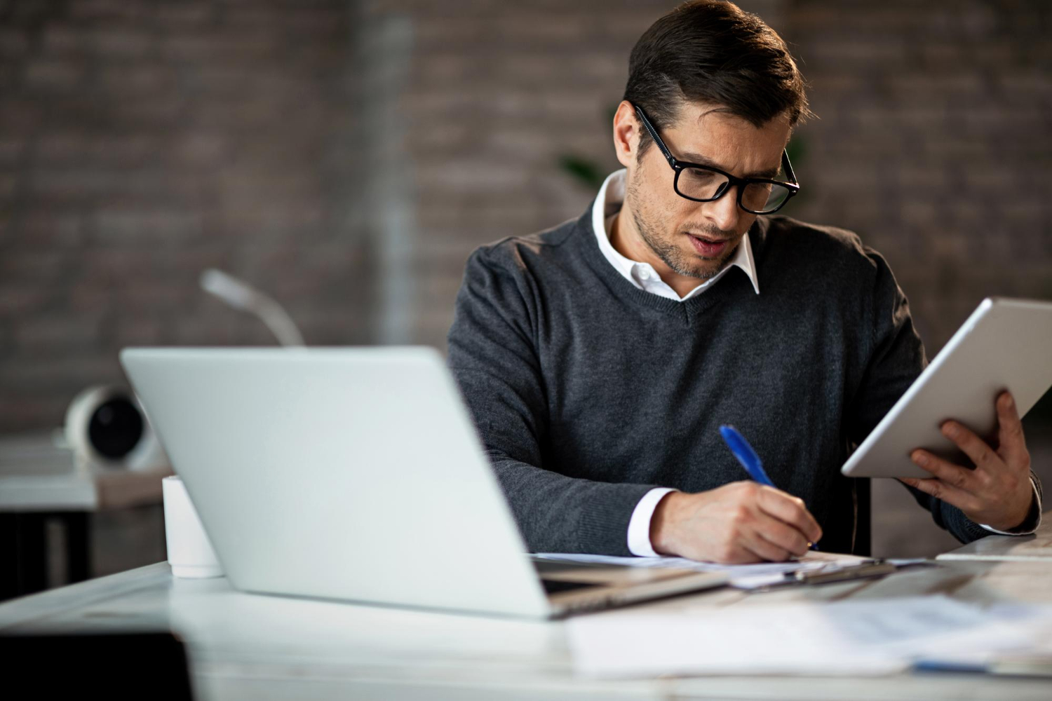 816 business owner planning business loan strategy with financial documents
