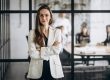 Image of confident businesswoman illustrates blog: What Is a Bridge Loan?