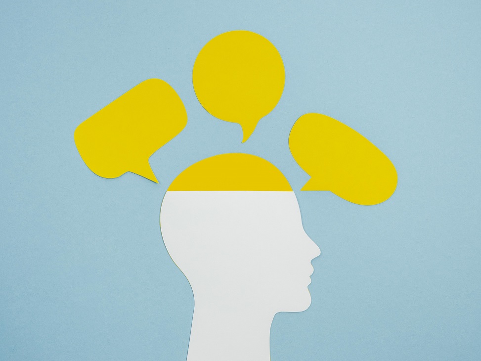 Profile of man with speech bubbles around him illustrates blog "Emotional Intelligence and Your Money"