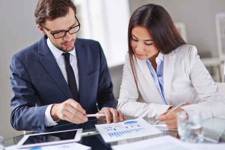 image-business-loan-covenants-explained Business owner reviewing loan covenants with financial documents