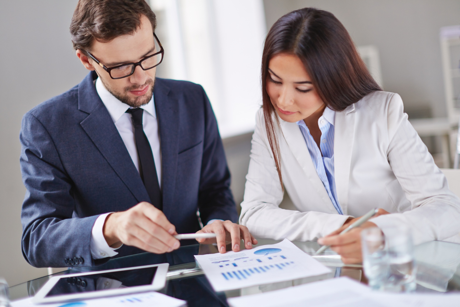 Business owner reviewing loan covenants with financial documents