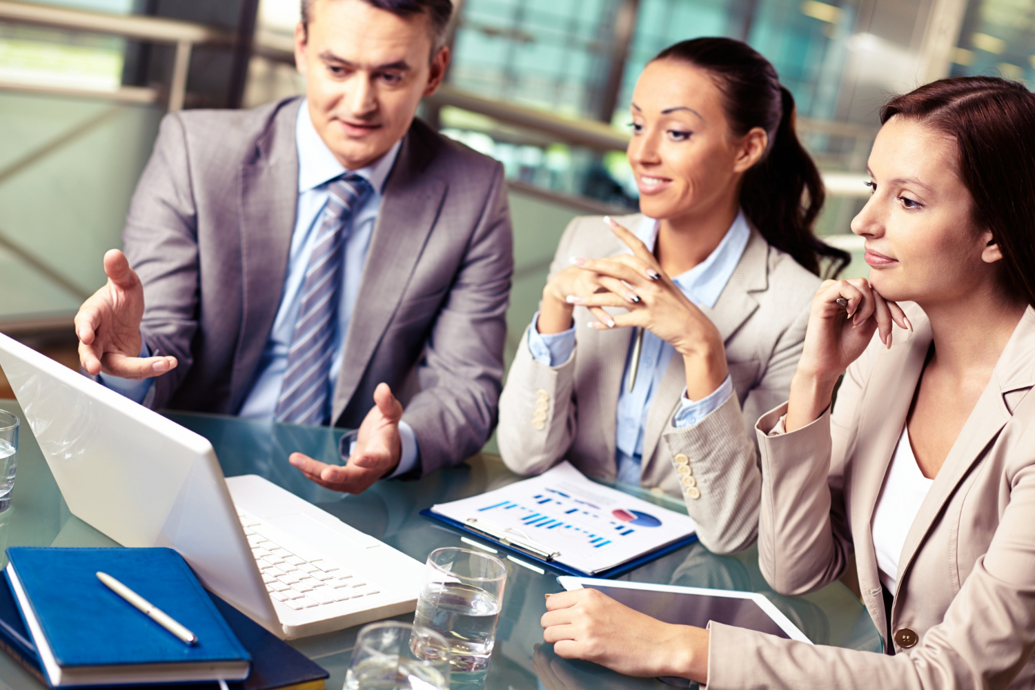 Professionals reviewing commercial loans capitalize market strategy and planning documents