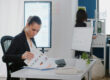 Professionals reviewing determine right borrowing amount strategy and planning documents