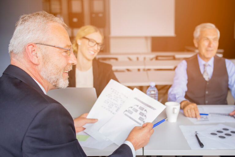 image-finance-business-succession-plan Owners reviewing financing options for a business succession plan