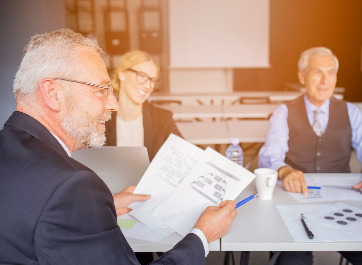 image-finance-business-succession-plan Owners reviewing financing options for a business succession plan
