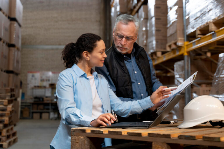 image-funding-warehouse-and-distribution Professionals reviewing funding warehouse and distribution strategy and planning documents