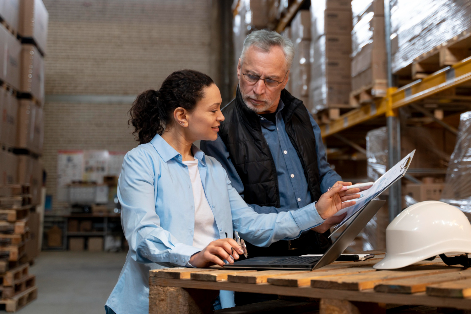 image-funding-warehouse-and-distribution Professionals reviewing funding warehouse and distribution strategy and planning documents