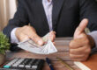 Business owner reviewing business cash reserves before applying for financing