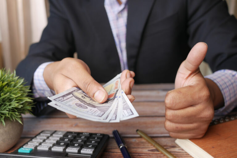 Business owner reviewing business cash reserves before applying for financing