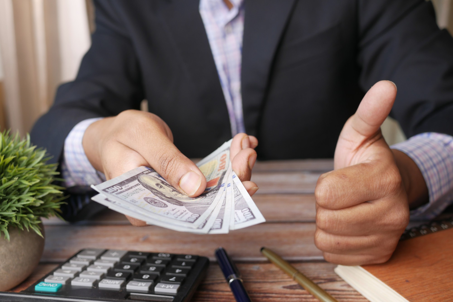 Business owner reviewing business cash reserves before applying for financing