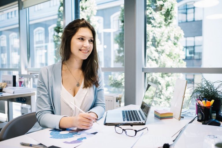 Woman in office illustrates blog "Understanding the Different Types of Business Loans Available to SMEs"